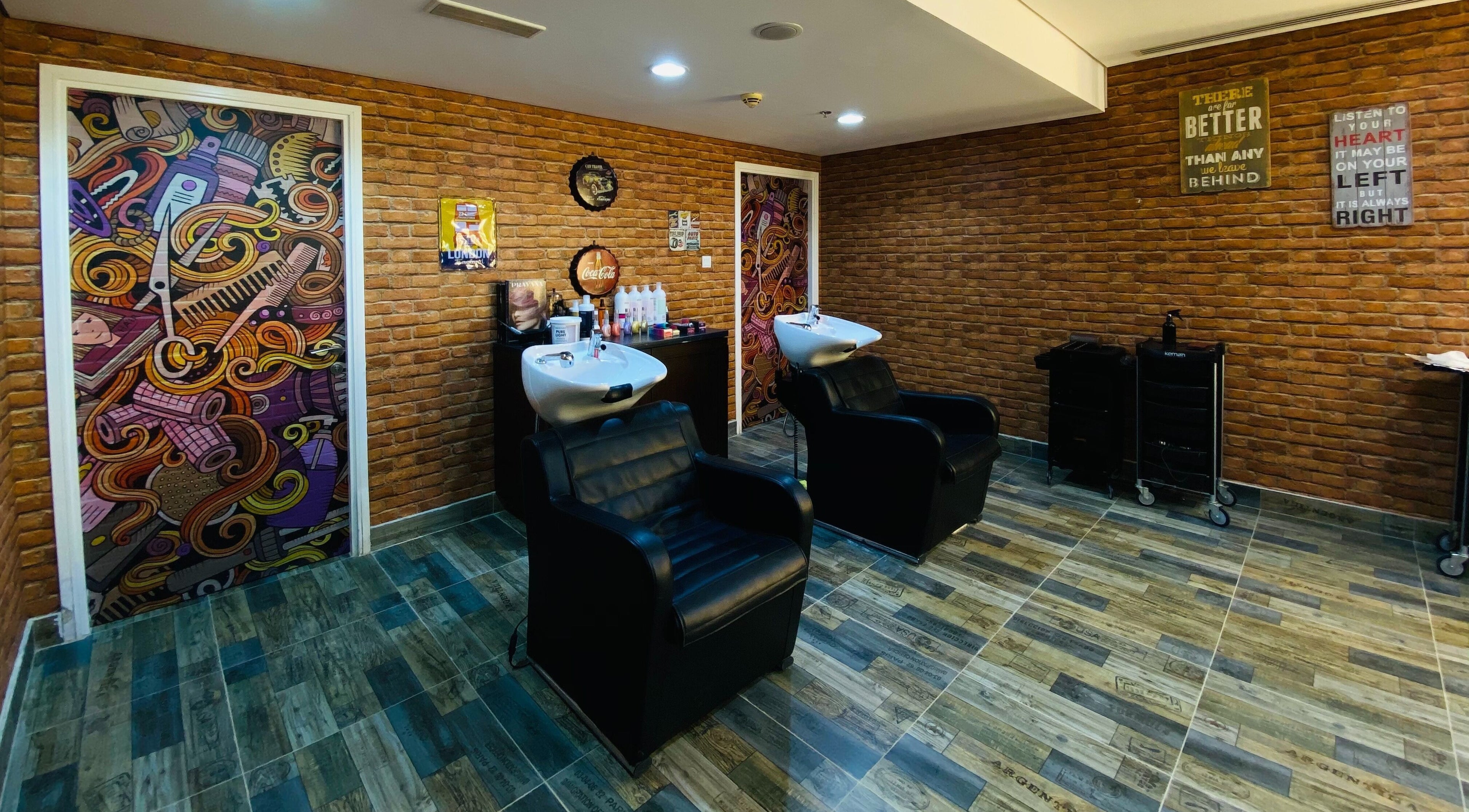 Modern salon wash area at Glam Street DMCC in Dubai, AE with chic decor and comfortable chairs.