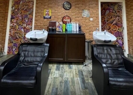 Modern shampoo chairs in Glam Street DMCC, Dubai, AE, with stylish brick decor.