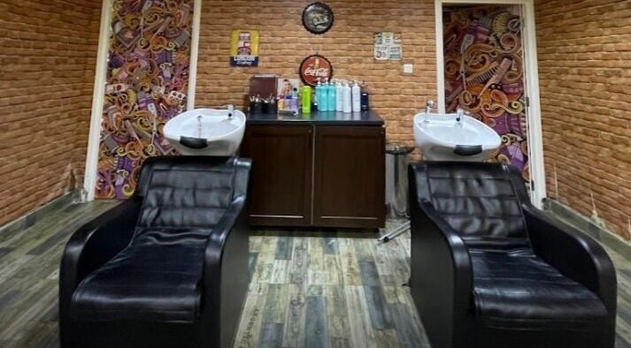 Modern shampoo chairs in Glam Street DMCC, Dubai, AE, with stylish brick decor.