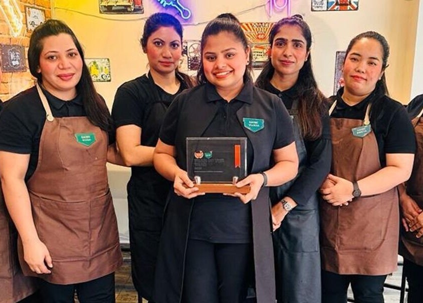 Team at Glam Street DMCC in Dubai, AE proudly holding an award, showcasing exceptional beauty services.