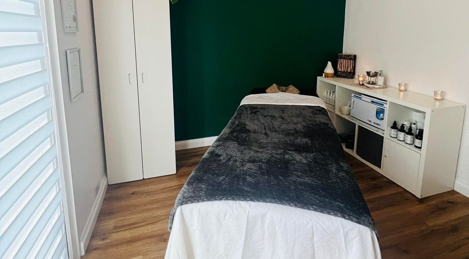 Peaceful massage room at Massage by Laura, Derby, England, GB. Features a comfortable table and relaxing ambiance.