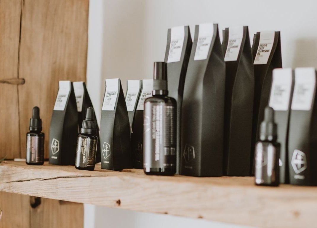 Luxurious beauty elixirs on a wooden shelf at Soulflower Studio, Sawtell, New South Wales, AU.