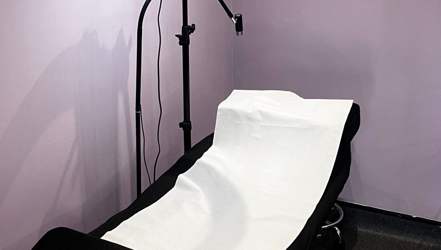 Treatment bed in Pro Studio Bournemouth with soft lighting, located in Bournemouth, England, GB.