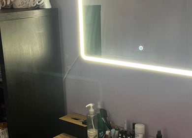 Elegant mirror with LED lighting at Pro Studio Bournemouth, beautifying space in Bournemouth, England, GB.
