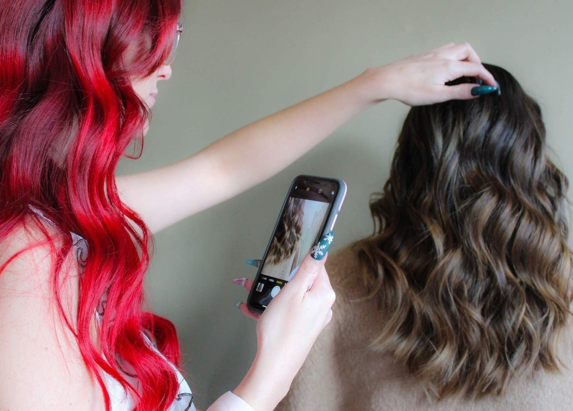 Hair stylist capturing styled hair at Modcrown Creations in Oshawa, Ontario, CA.