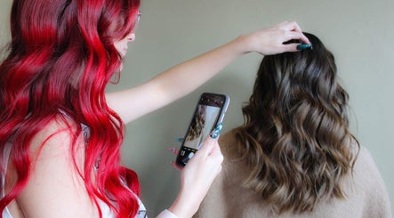 Hair stylist capturing styled hair at Modcrown Creations in Oshawa, Ontario, CA.