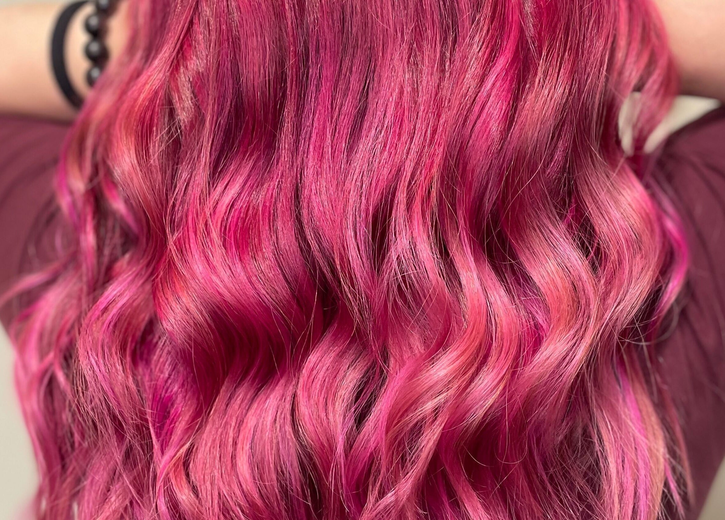 Vibrant pink hair waves styled at Modcrown Creations in Oshawa, Ontario, CA.