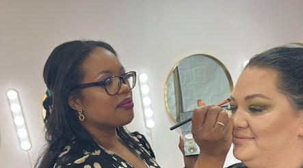 Makeup artist at Glam by Joanna B, Tewkesbury, applies eyeshadow with precision.