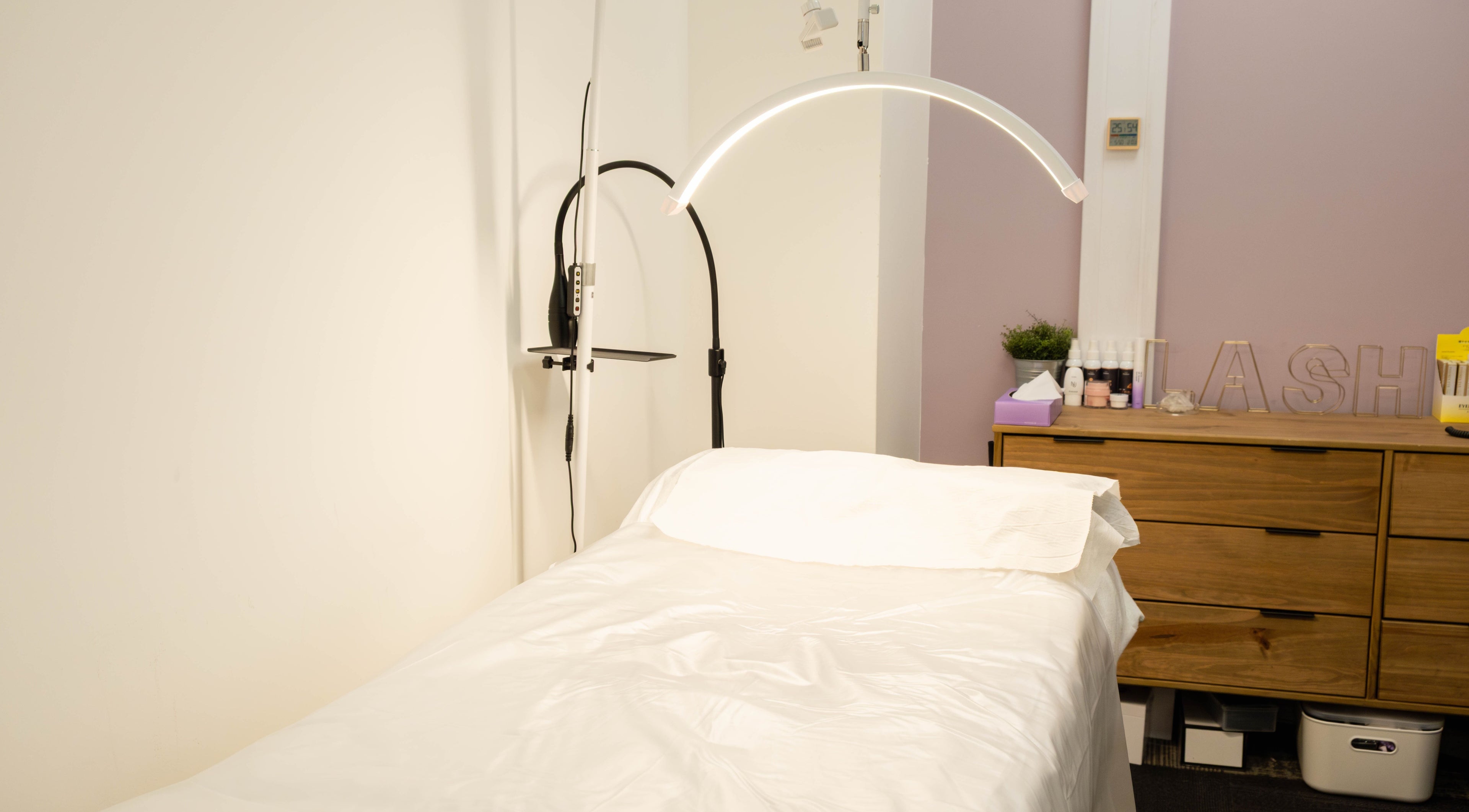 Cozy treatment room at BIYU Lash Hanover Sq., London, England, GB with a soft bed and elegant decor.