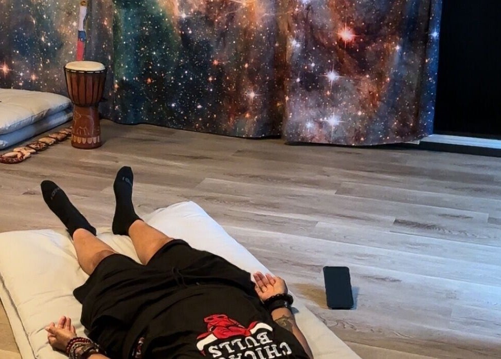 Relaxation session at Blue Lotus Healz in Chicago, Illinois, US with calming cosmic decor.