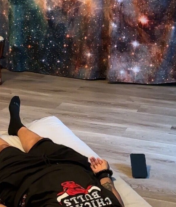 Relaxation session at Blue Lotus Healz in Chicago, Illinois, US with calming cosmic decor.