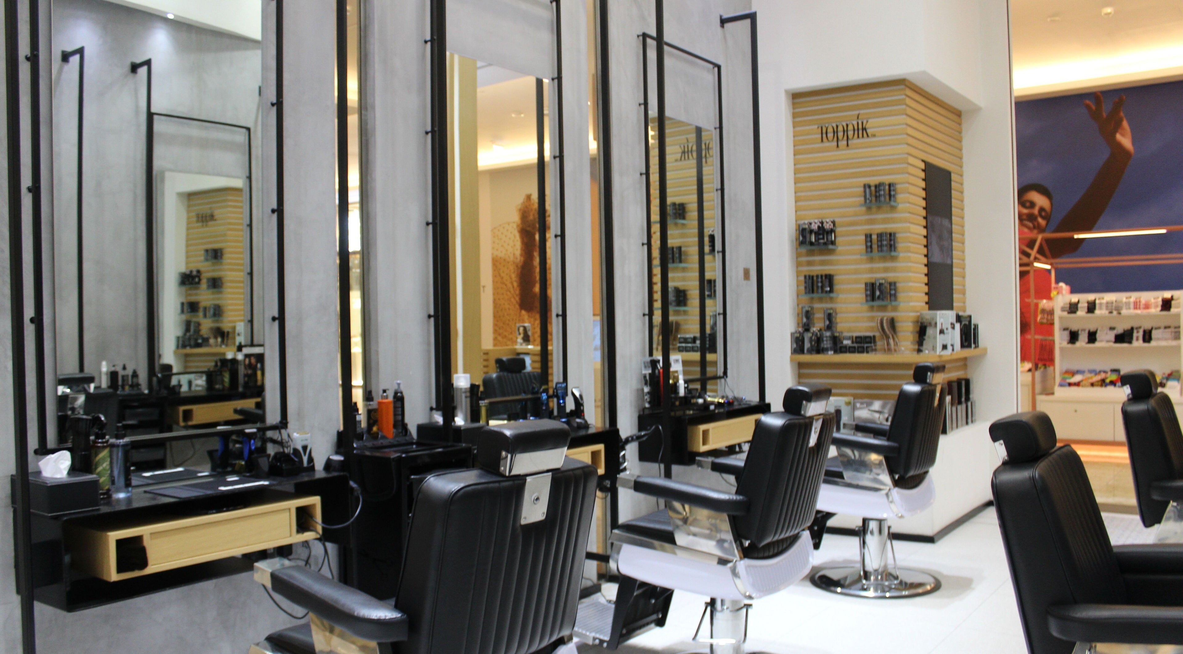 Elegant barber chairs at La Sala Gents Salon, Dubai, Dubai, AE offering modern grooming services.
