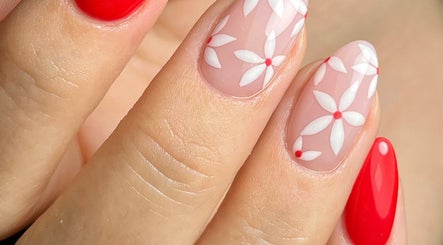 Red and floral nail art at Ella Nails Design, Alberton, Gauteng, ZA showcasing elegance and style.