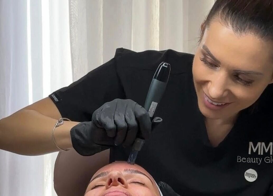 Beauty professional at MM Beauty Glow in Noranda, Western Australia, AU, performing a facial treatment.