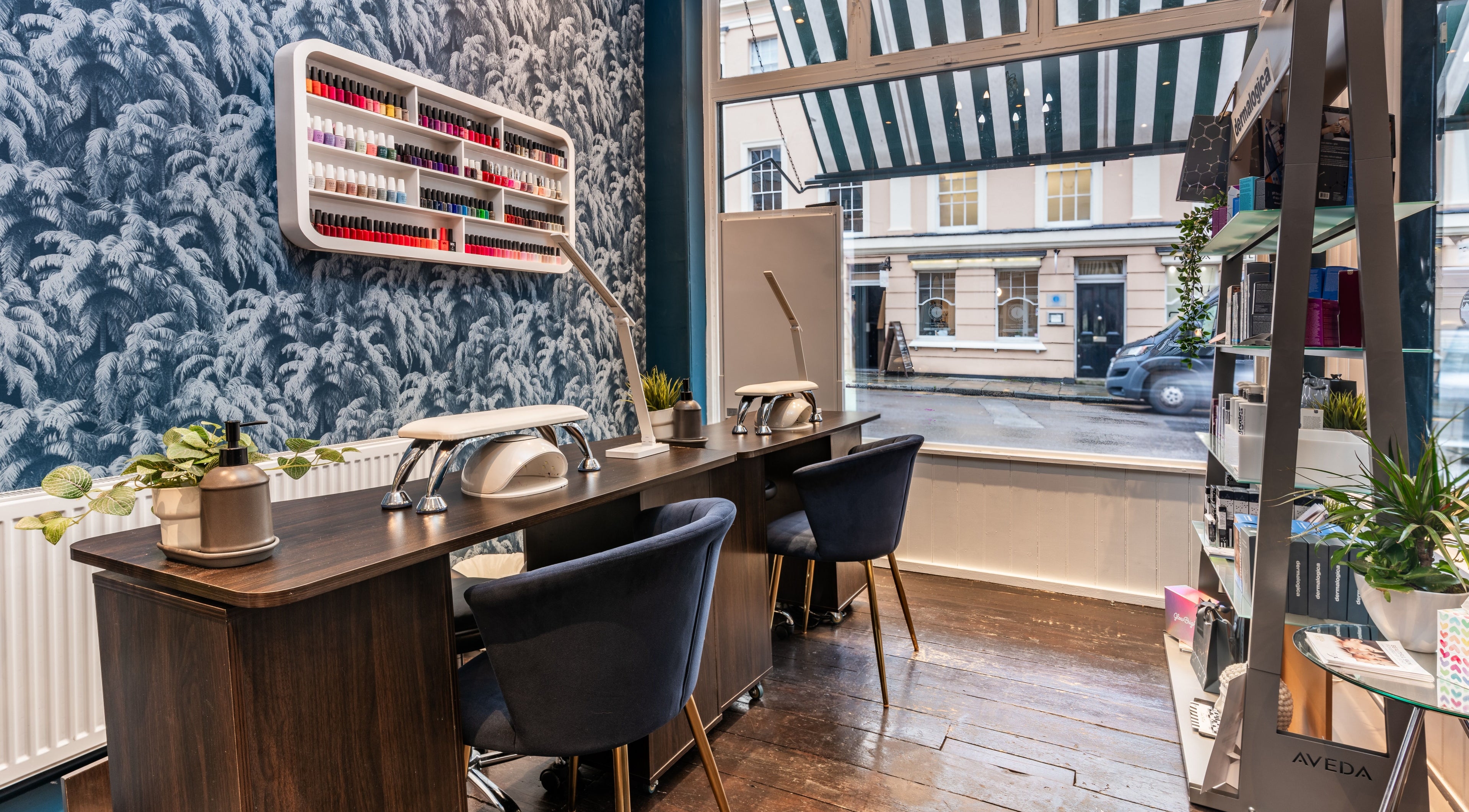 Elegant nail station at The Greenwich Spa in London, England, GB with vibrant polish display and modern decor.