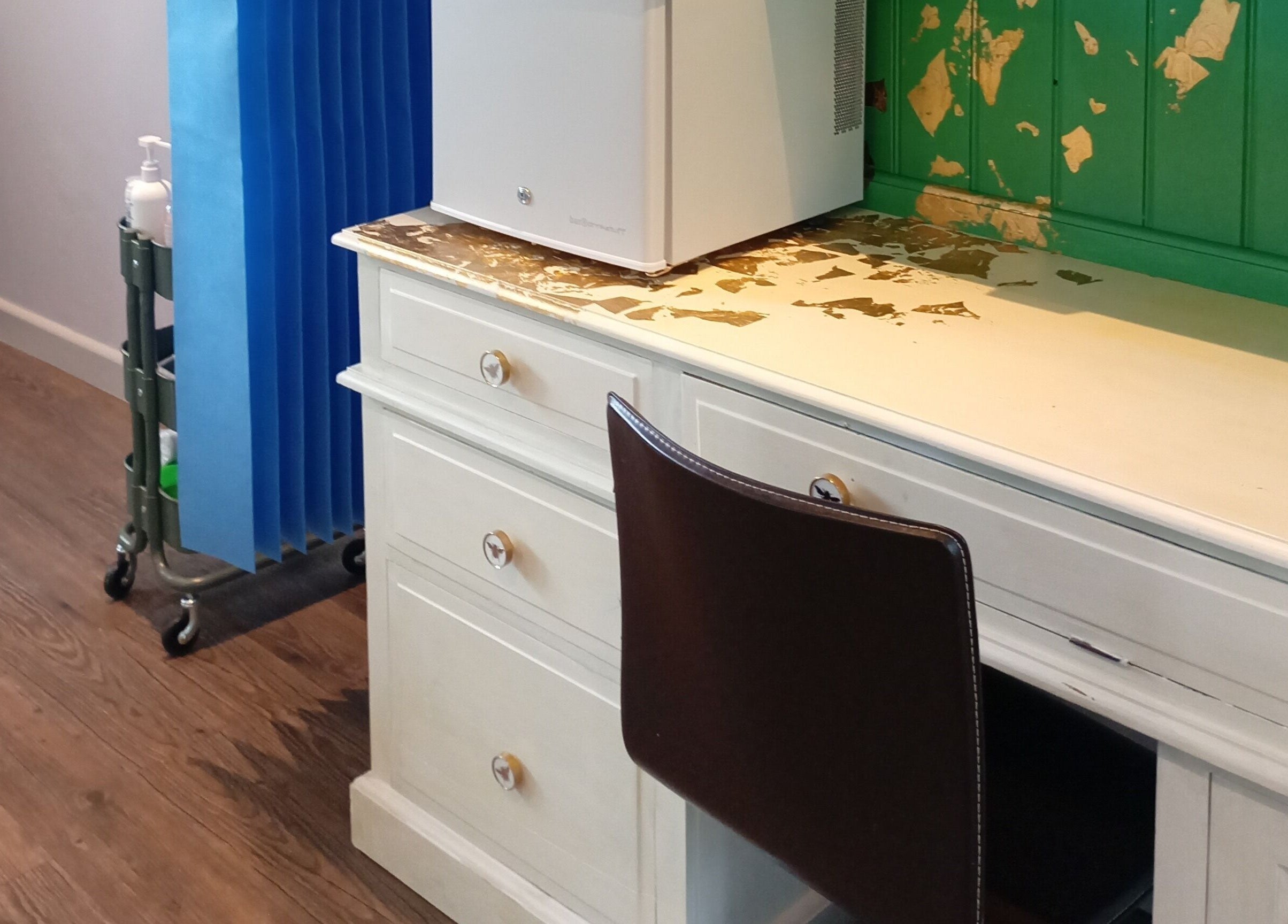 Elegant treatment area at Truly Confident Aesthetics, Helpston, England, GB with modern desk and chair.