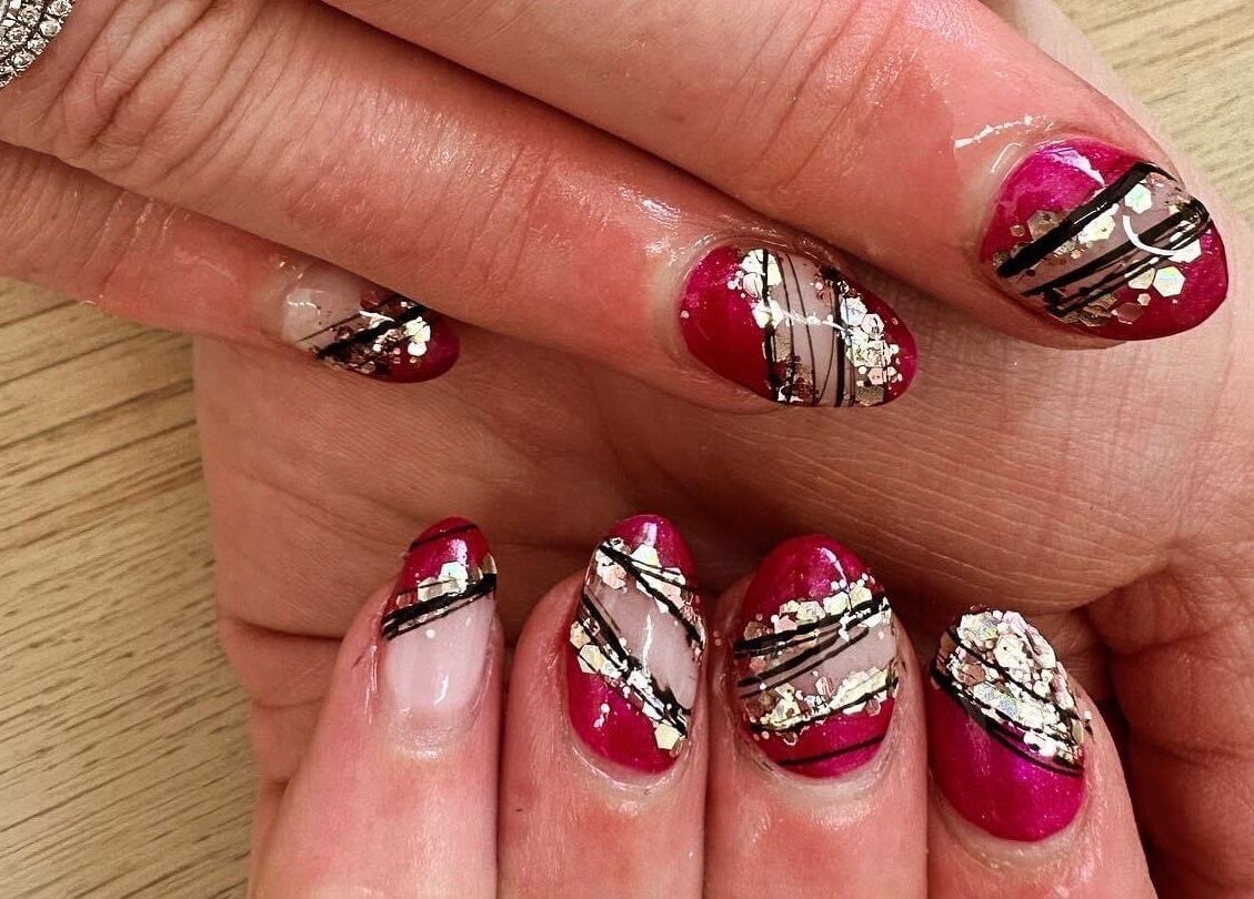 Stylish nail art featuring red and black designs at Polished by Makala, Mountain Creek, Queensland, AU.