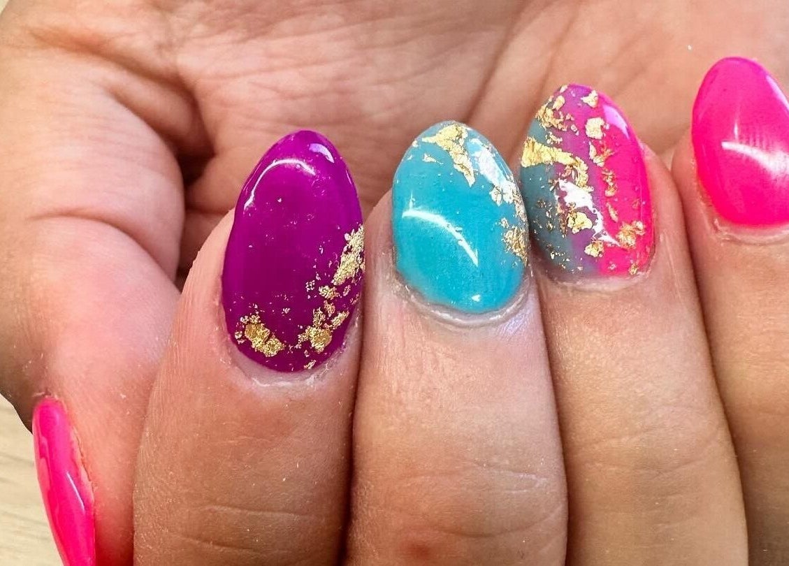 Colorful manicure with gold leaf design at Polished by Makala, Mountain Creek, Queensland, AU.