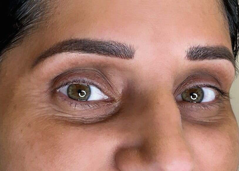 Close-up of expertly shaped eyebrows at Matthews, North Carolina, US beauty center.