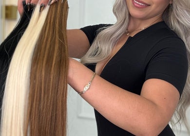 Expert displays hair extensions at Erika Lara in El Paso, Texas, US, emphasizing quality hair styling.