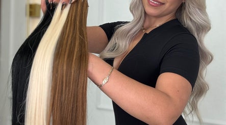 Expert displays hair extensions at Erika Lara in El Paso, Texas, US, emphasizing quality hair styling.