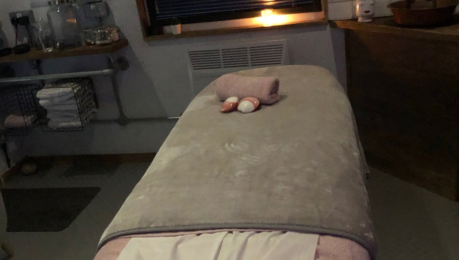 Tranquil massage room at The Beauty Shack by Lottie, Banbury, England, GB with a cozy treatment bed.