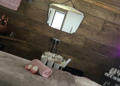 Relaxation room at The Beauty Shack by Lottie, Banbury, England, GB, featuring a massage table and warm lighting.