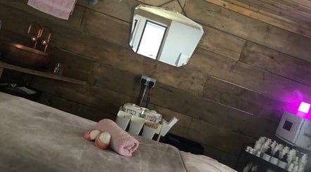 Relaxation room at The Beauty Shack by Lottie, Banbury, England, GB, featuring a massage table and warm lighting.