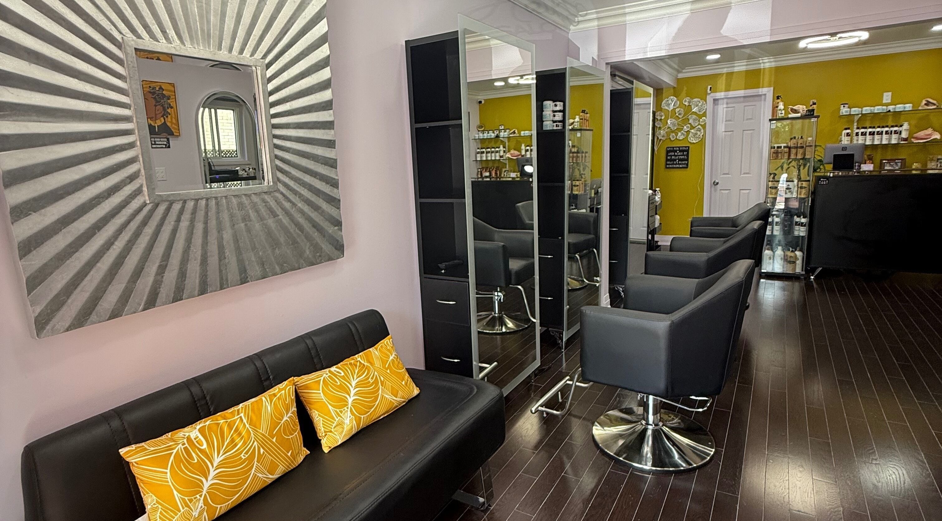 Elegant interior of My Butopia Salon, Ajax, Ontario, CA, featuring stylish chairs and decor.