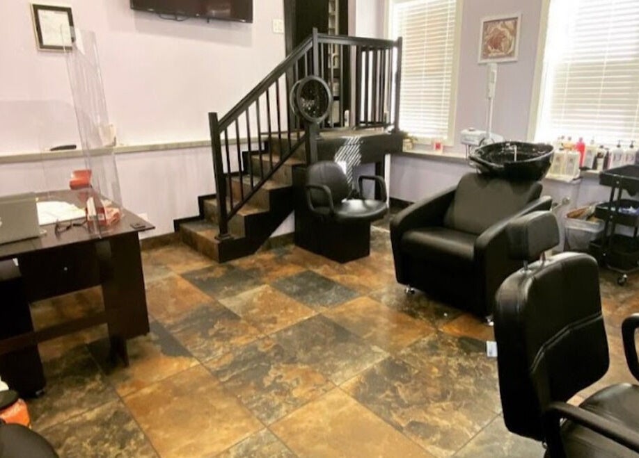 Modern salon interior at My Butopia Salon in Ajax, Ontario, CA, featuring stylish chairs and workstation.