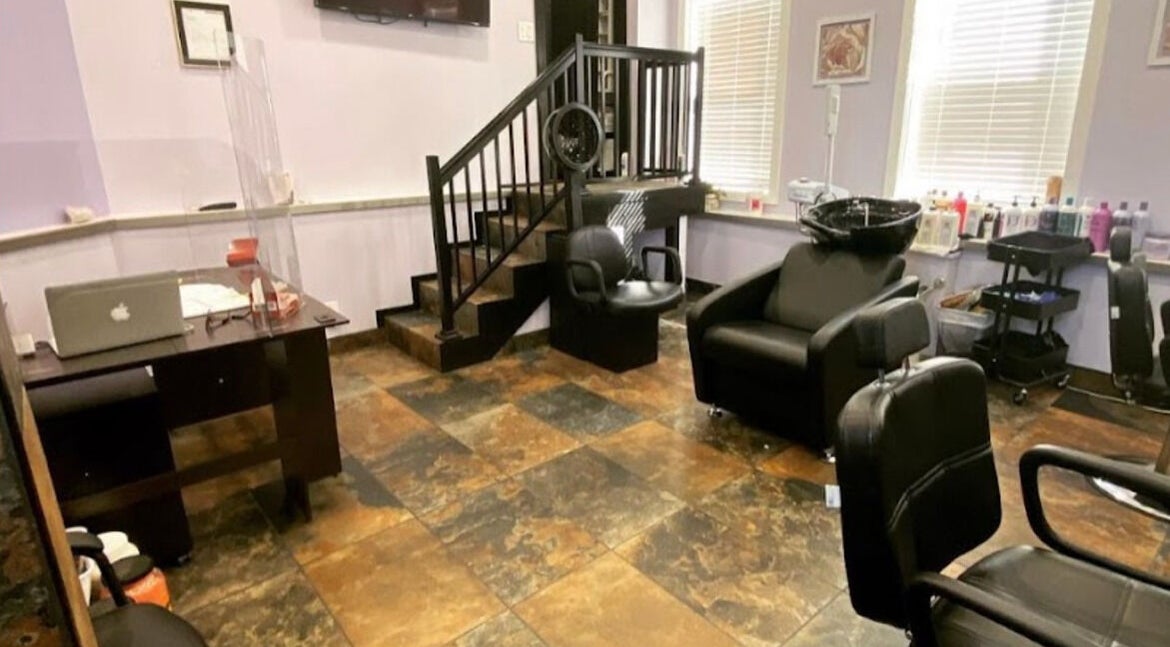 Modern salon interior at My Butopia Salon in Ajax, Ontario, CA, featuring stylish chairs and workstation.