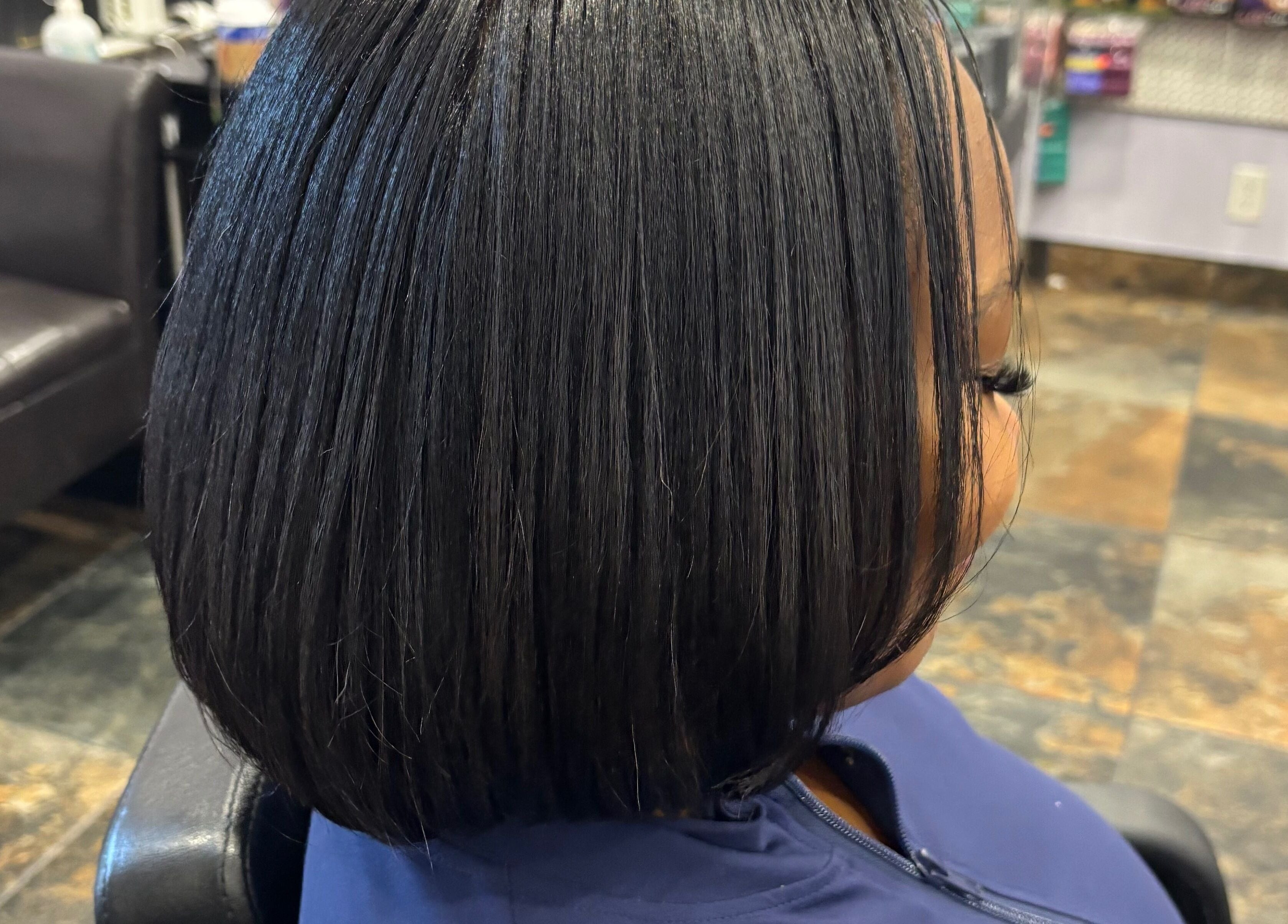 Sleek bob hairstyle at My Butopia Salon, Ajax, Ontario, CA. Stylish, modern look in a chic salon setting.