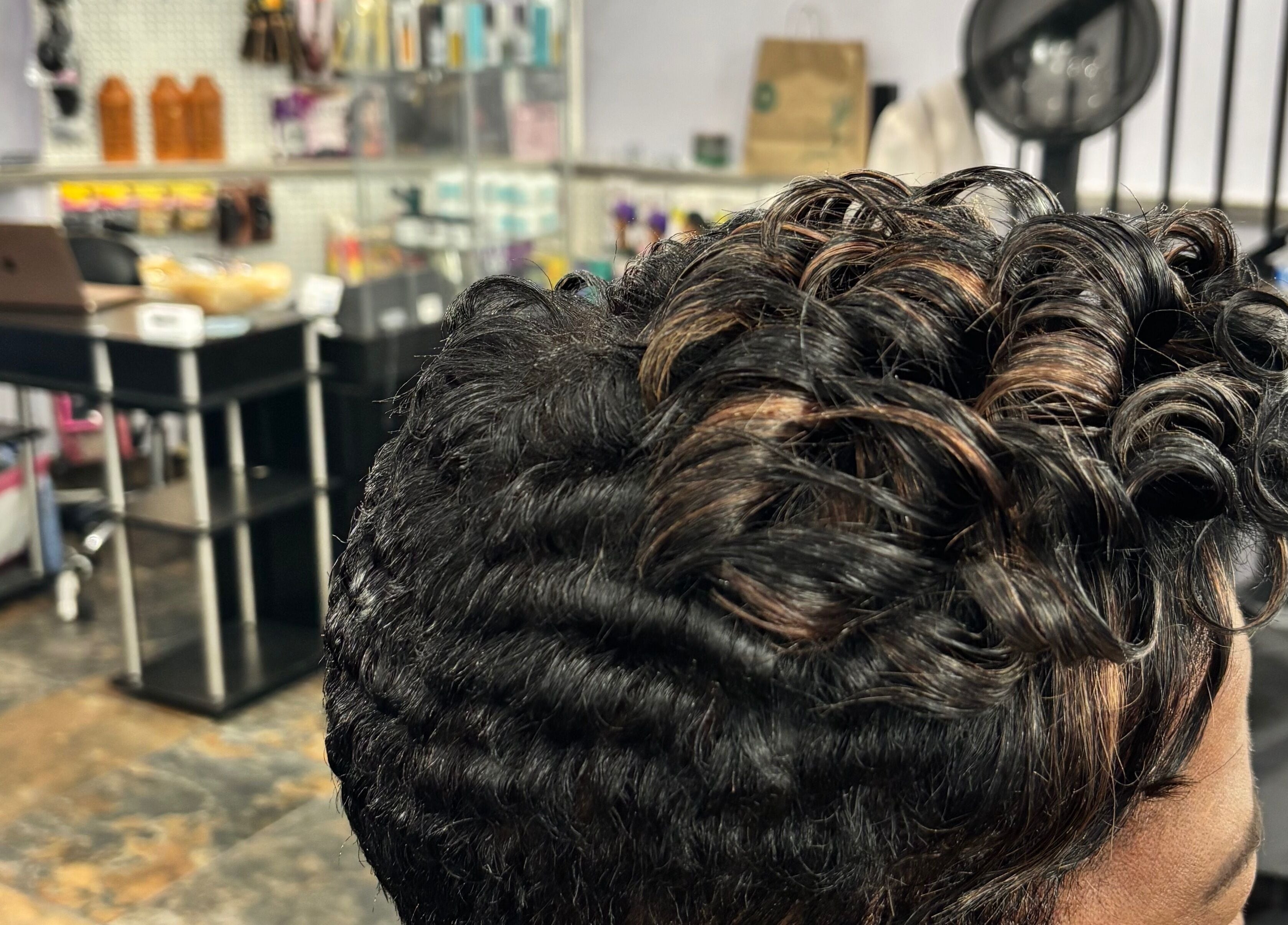 Elegant curled hairstyle at My Butopia Salon in Ajax, Ontario, CA, showcasing professional beauty service.