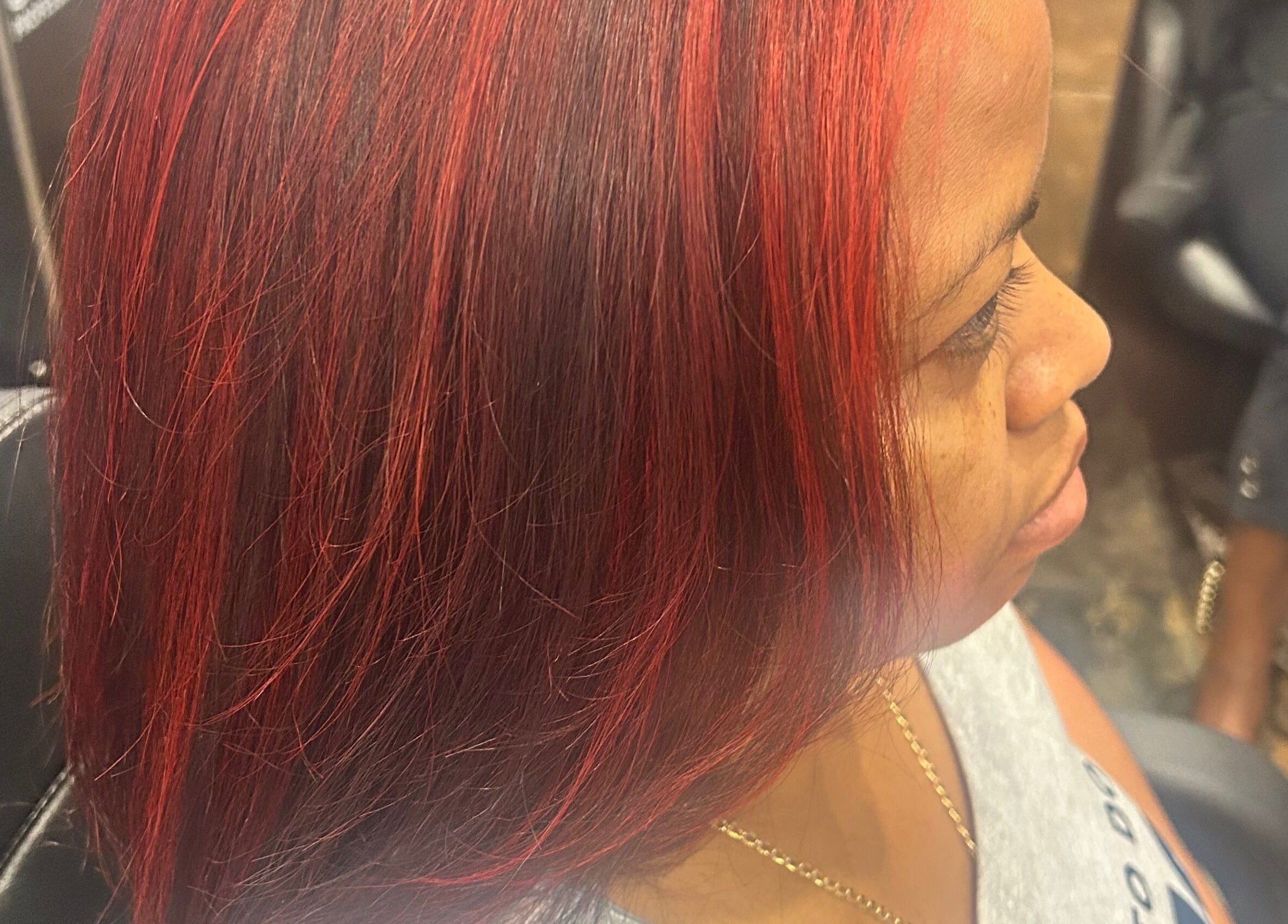 Woman with vibrant red hair at My Butopia Salon in Ajax, Ontario, CA.
