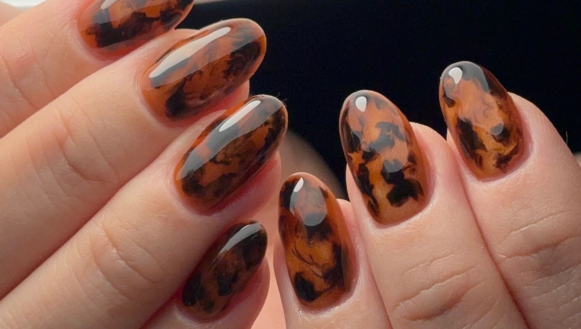 Stylish tortoise shell nail art at Kana's Alter Ego Nail Studio, Ashmore, Queensland, AU.