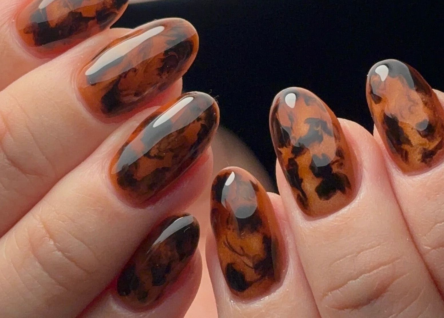 Stylish tortoise shell nail art at Kana's Alter Ego Nail Studio, Ashmore, Queensland, AU.