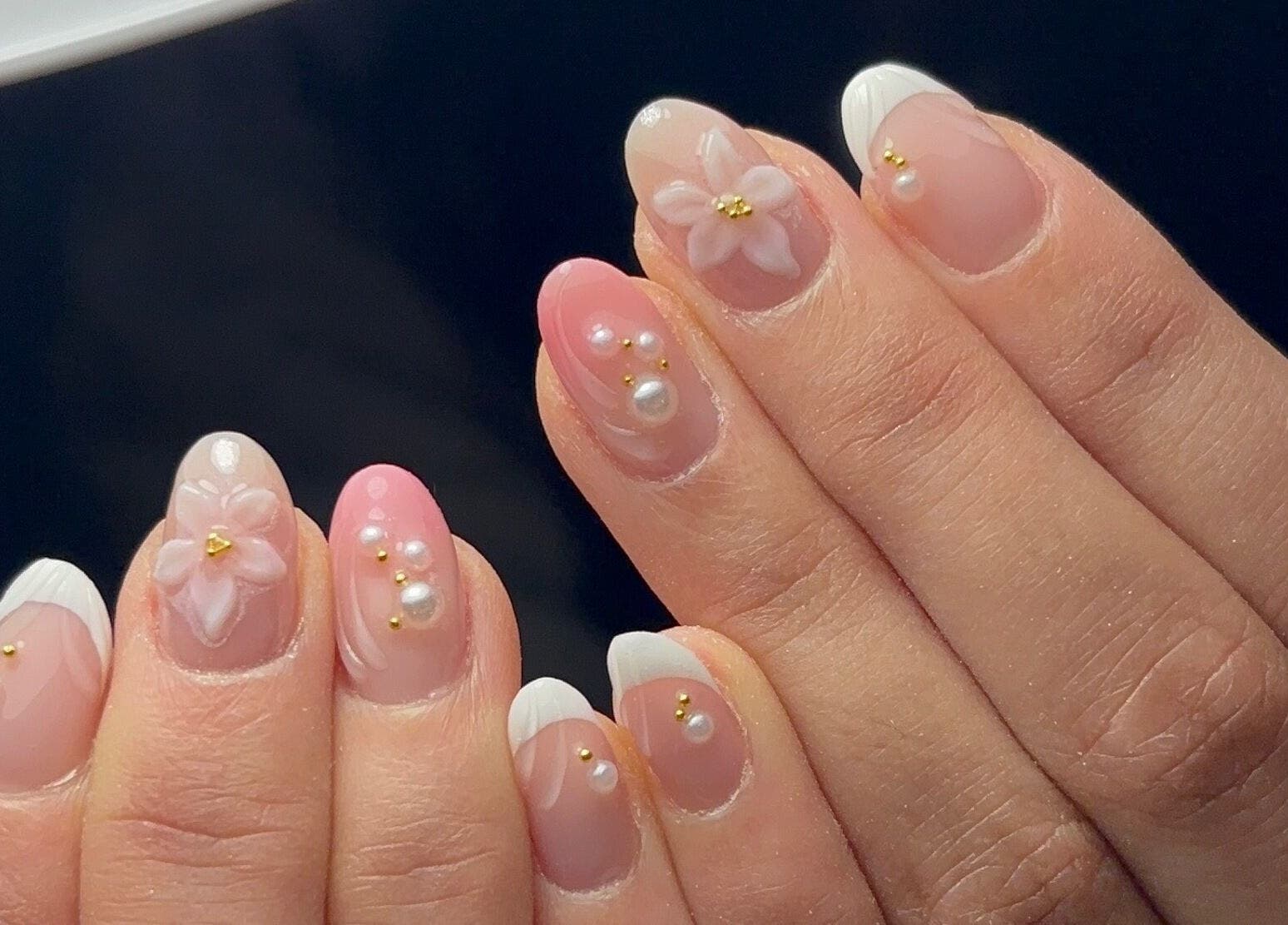 Elegant floral and pearl nail art at Kana's Alter Ego Nail Studio, Ashmore, Queensland, AU.