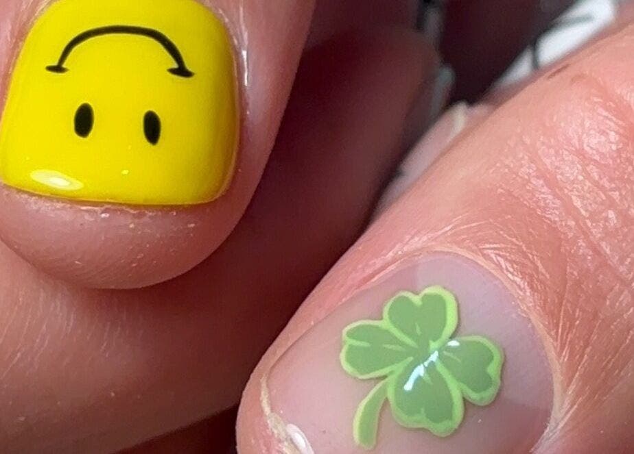 Unique nail art with smiley face and clover at Kana's Alter Ego Nail Studio, Ashmore, Queensland, AU.