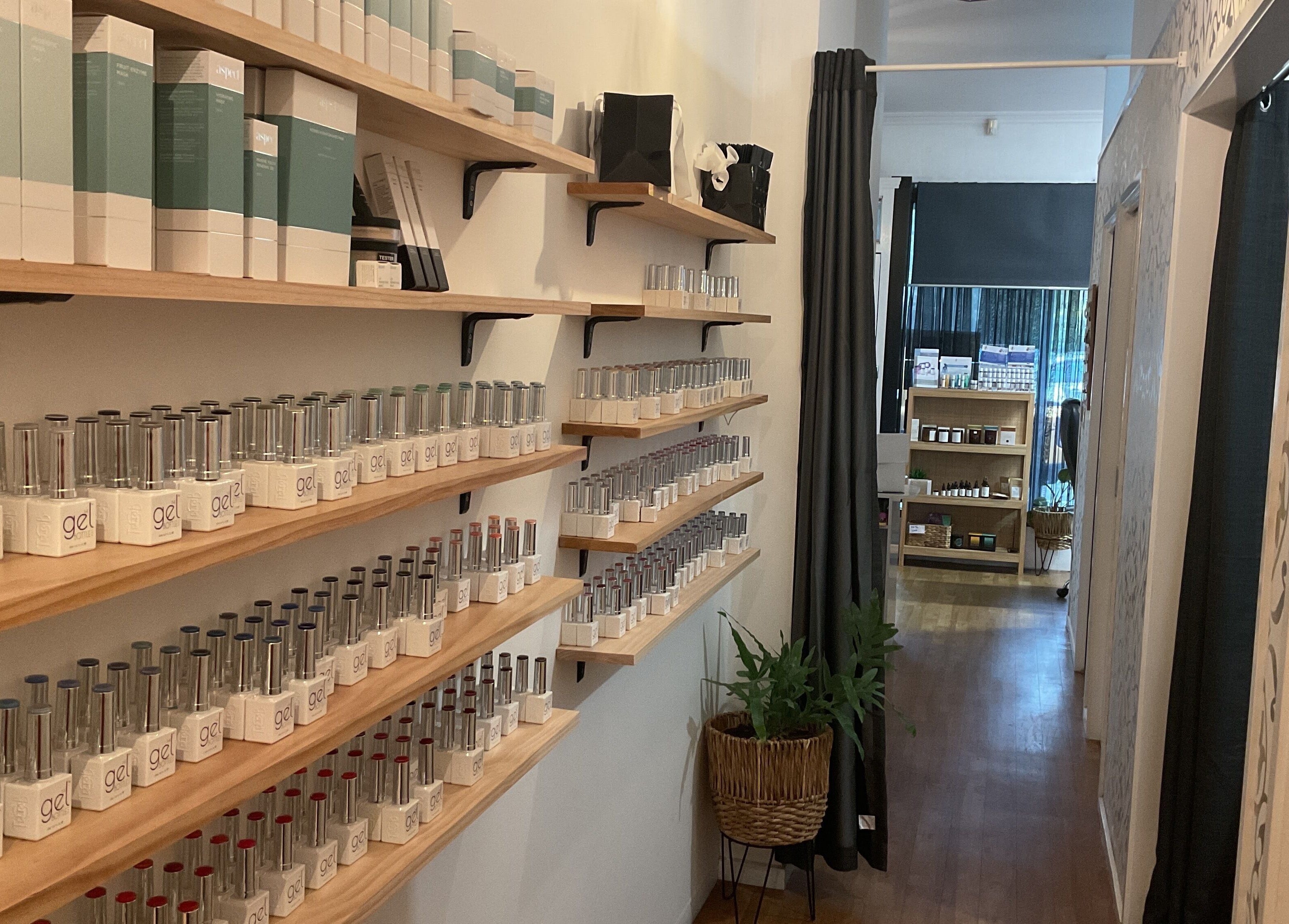 Shelves of gel nail products at Nails & More Salon, Maffra, Victoria, AU, showcasing variety and elegance.
