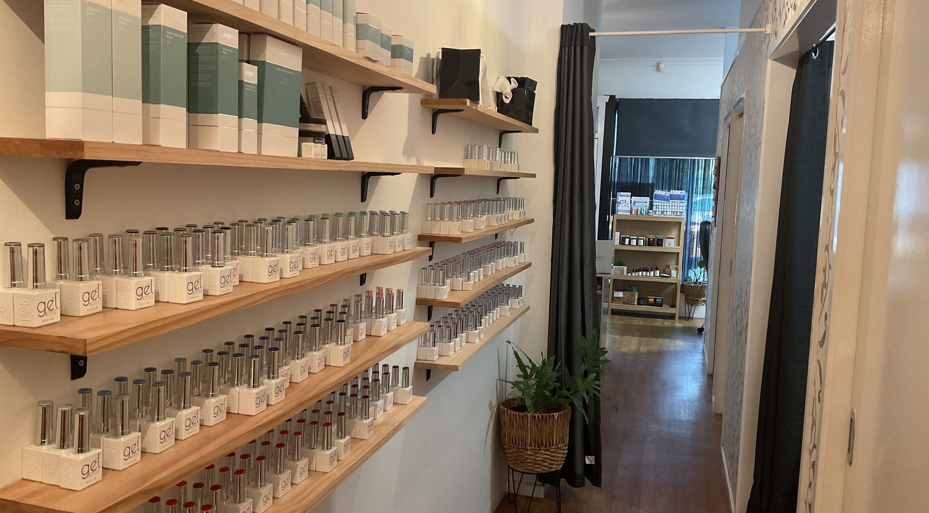 Shelves of gel nail products at Nails & More Salon, Maffra, Victoria, AU, showcasing variety and elegance.