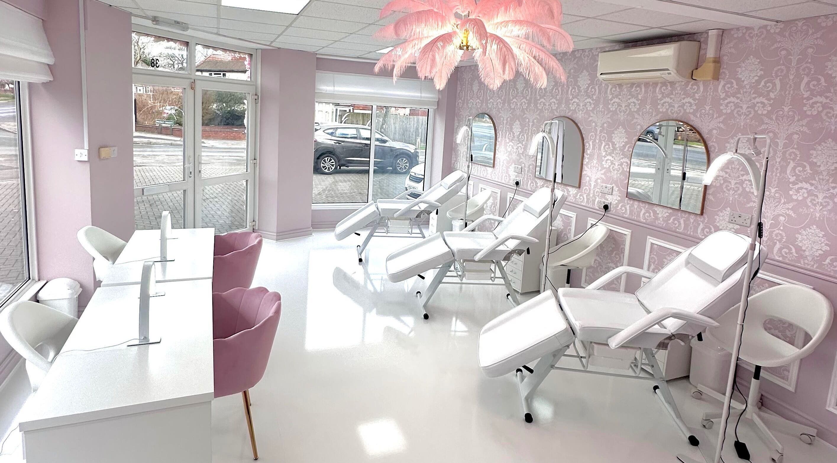 Bright, elegant treatment room at Belle et Rose Aesthetics, Birmingham, England, GB featuring plush chairs.
