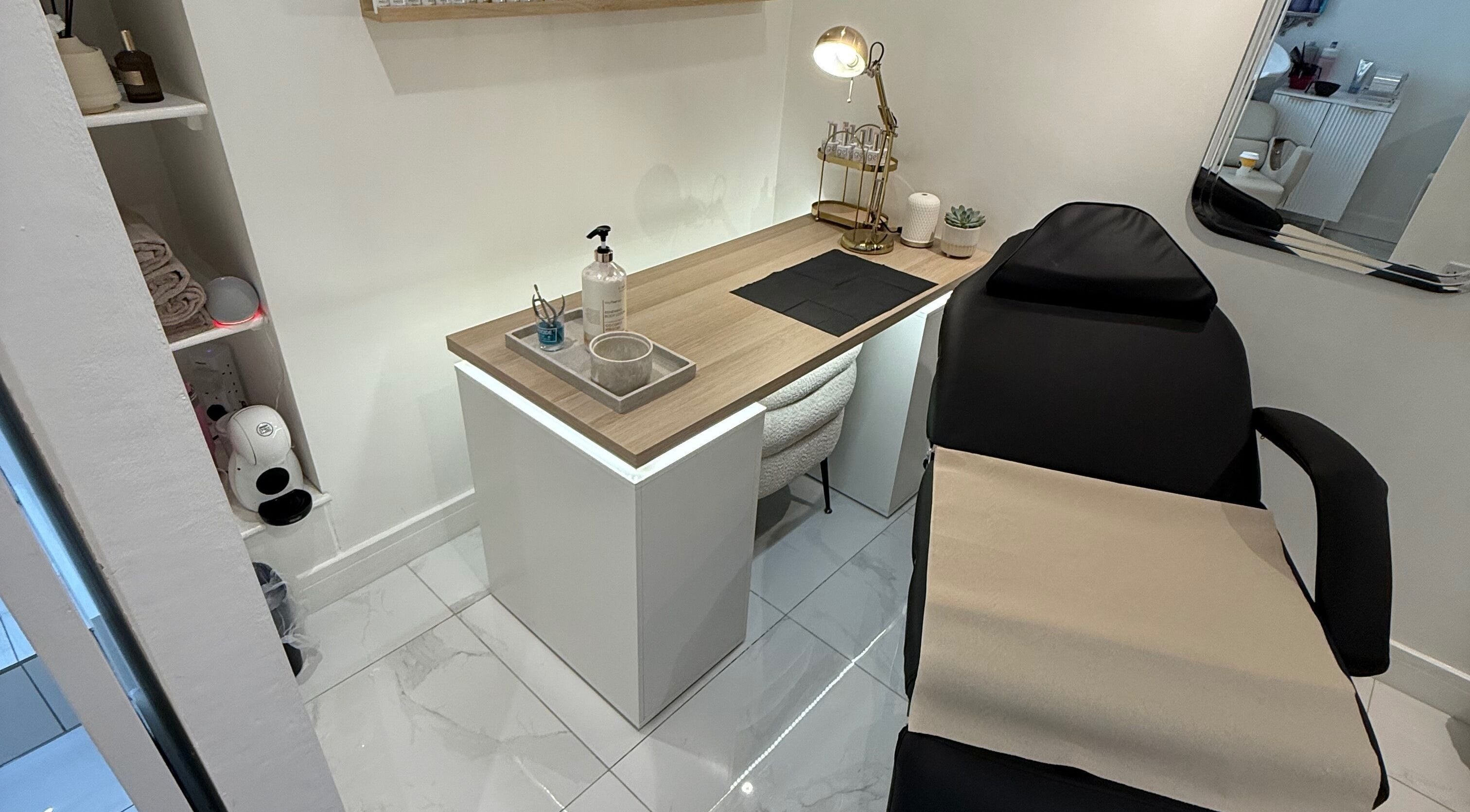 Modern nail station at By Alice in Cleckheaton, England, GB with stylish decor and comfy seating.