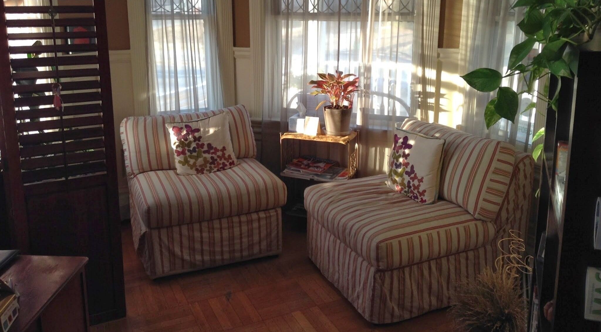 Inviting seating area at Body Kneads™, Inc. (Providence) in Providence, Rhode Island, US, exuding warmth and comfort.