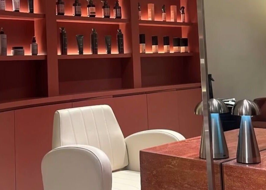 Luxurious salon chair and product display at Beyond Beauty, Ajman, Ajman, AE.