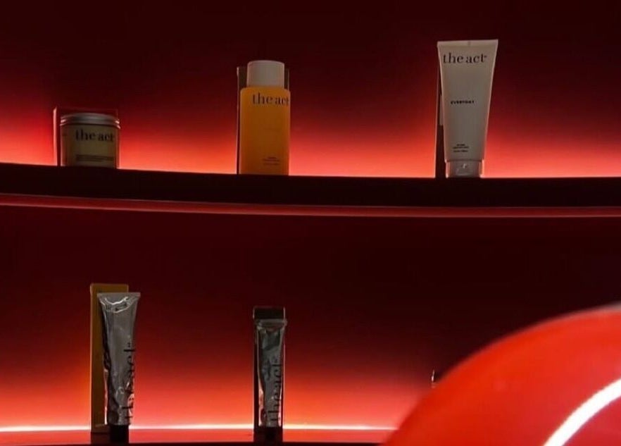 Luxurious beauty products on glowing red shelves at Beyond Beauty, Ajman, Ajman, AE.