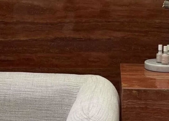 Elegant lounge area at Beyond Beauty, Ajman, AE with cozy sofa and stylish decor.