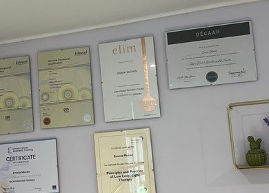 Wall with certificates at The Beauty Cabin Reigate, showcasing excellence in Reigate, England, GB.