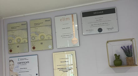 Wall with certificates at The Beauty Cabin Reigate, showcasing excellence in Reigate, England, GB.