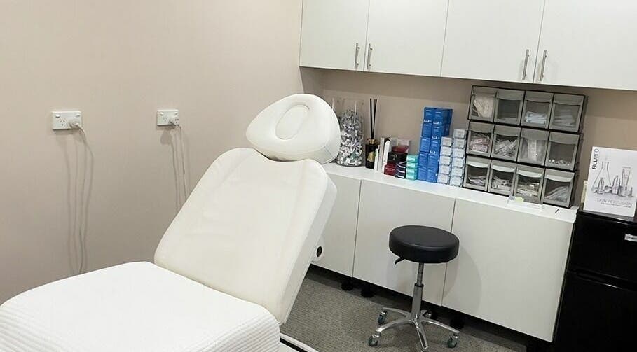 Relaxing treatment room at Reyoung Skin Clinic, Epping, New South Wales, AU, featuring a spa chair and cabinets.