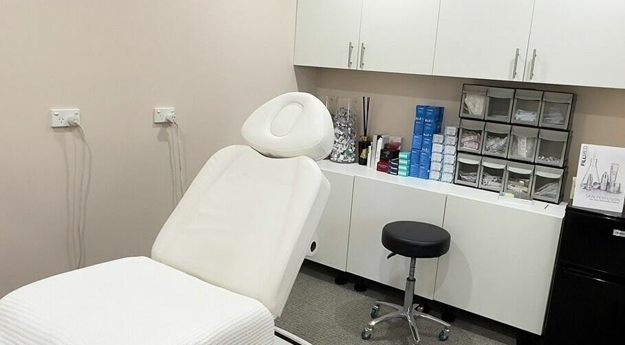 Relaxing treatment room at Reyoung Skin Clinic, Epping, New South Wales, AU, featuring a spa chair and cabinets.